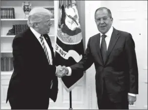  ?? The Associated Press ?? OVAL OFFICE This handout photo released by the Russian Ministry of Foreign Affairs shows President Donald Trump meeting with Russian Foreign Minister Sergey Lavrov on May 10 in the Oval Office of the White House in Washington. The Washington Post is...