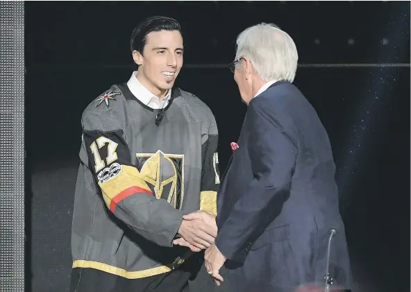  ?? — GETTY IMAGES ?? Goaltender Marc-Andre Fleury shakes hands with majority owner Bill Foley of the Vegas Golden Knights after Fleury was taken by the Golden Knights in the expansion draft on Wednesday.