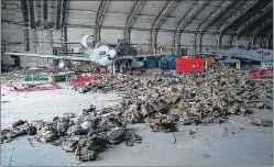  ?? AFP ?? Abandoned Afghan Air Force aircraft and armoured vests at the Kabul airport.