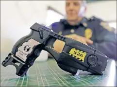  ??  ?? No electric toy: Tasers can send their victims into deadly cardiac arrest.