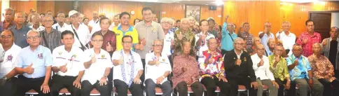  ??  ?? Jamit (seated, fifth left), flanked by Baja on his left and associatio­n secretary Usa Dana, in a group photo with PVATM Kapit members during its AGM.