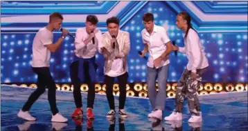  ??  ?? Jack Tisdall (second from left) performing with Vibe 5 on the X Factor.