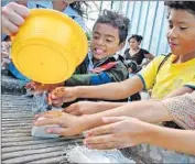  ?? Clean the World ?? CHILDREN IN HONDURAS, one of the 99 countries in which Clean the World operates, wash their hands using soap provided by the charity.