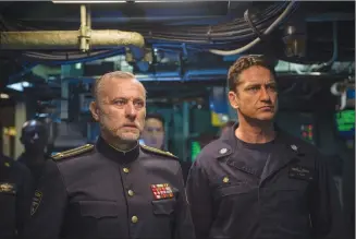  ?? Associated Press photo ?? This image released by Lionsgate shows Michael Nyqvist and Gerard Butler in a scene from “Hunter Killer.”