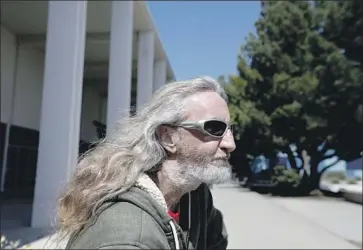  ?? Francine Orr Los Angeles Times ?? BILL WITTER, 45, sits outside the county library and vacant courthouse in Malibu. The Pennsylvan­ia native spends the night at a Santa Monica shelter while he waits for housing, but he hangs out in Malibu by day.