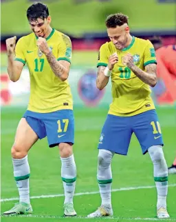  ?? — AP ?? Brazil’s Neymar (right) celebrates with Lucas Paqueta after scoring his team’s second goal against Ecuador during a World Cup qualifying match at Beira-Rio stadium in Porto Alegre. Brazil won 2-0.