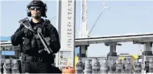  ?? | GREGORY BULL AP ?? DURING a training drill earlier this year, customs and border protection officials block the entrance to the San Ysidro port of entry, seen from Tijuana, Mexico.