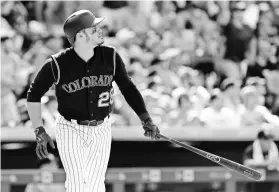  ?? ISAIAH J. DOWNING, USA TODAY SPORTS ?? Rockies slugger Nolan Arenado watches one of his 41 homers in 2016. He has 83 over the last two seasons with 263 RBI.