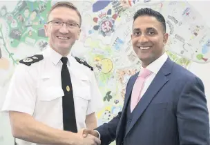  ??  ?? ●●Chief Constable Ian Hopkins welcomes new Assistant Chief Constable, Mabs Hussain to GMP.