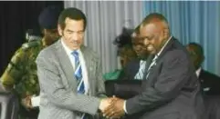  ?? ?? In happier times: Ian Khama (L) handpicked Mokgweetsi Masisi (R) to be his successor as Botswana president in 2018