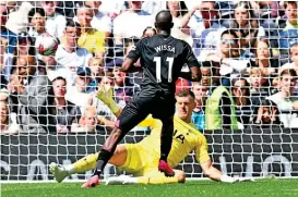  ?? ?? Brentford's Yoane Wissa scores past Tottenham goal keeper Fraser Forster during their English Premier League match in London on Saturday (AFP)