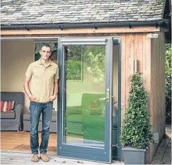  ??  ?? John Langley from JML Contracts demonstrat­ed the SIPS system to Grand Designs presenter Kevin Mccloud.