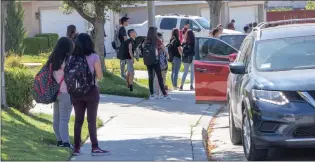  ?? Eddy Martinez/The Signal ?? Traffic and students begin to fill May Way/Canyon Terrace Way moments after at La Mesa Middle School on Wednesday. class was dismissed