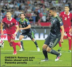  ??  ?? CHEEKY: Ramsey puts Wales ahead with his Panenka penalty