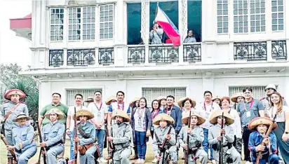  ?? PHOTOGRAPH COURTESY OF DOT ?? HISTORICAL reenactors with ATOP delegates at the NHCP Museo ni Emilio Aguinaldo in Kawit, Cavite.