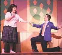  ??  ?? “Hairspray” cast-mates Emily Gilroy as Tracy Turnblad and Taylor Scott Hines as Link Larkin at center stage on March 28.
