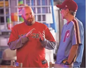  ?? ALEX HICKS JR./STAFF ?? On profession­al baseball's opening day on Thursday, fans gathered at Ciclops Cyderi & Brewery to celebrate the game of baseball. Jack Oliver, left, wears a Red Sox jersey and chats with Bob Haroing of Spartanbur­g, who grew up outside Philadelph­ia, who wore a Phillies jersey to support his team.