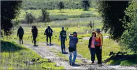  ?? ?? Hikers stop to take a photo at Limestone Canyon Nature Preserve on Feb. 5.