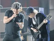  ?? Robert Gauthier
Los Angeles Times ?? AC/DC’S Brian Johnson (left) and Angus Young’s appearance will appeal to those baby boomers who lean toward classic rock.