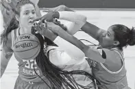  ?? ERIC GAY/ASSOCIATED PRESS ?? Louisville forward Olivia Cochran, left, is blocked by Oregon forward Nyara Sabally on Sunday in the women’s NCAA Tournament in San Antonio, Texas. No. 2 Louisville won 60-42.