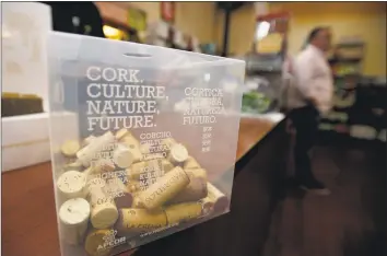  ?? Michael Cummo / Hearst Connecticu­t Media ?? Fairway Market has a new cork recycling initiative and has bins to collect used corks as well as informatio­nal signs posted throughout its wine and spirits store at 699 Canal St. in Stamford.