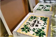  ?? The Sentinel-record/lance Brownfield ?? ■ Two cakes celebrate Alliance Rubber’s 100-year anniversar­y at a Friday luncheon before the Tuesday anniversar­y.