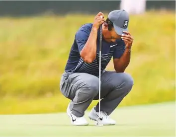  ?? USA Today Sports ?? Tiger Woods tries to gather his thoughts on the 16th green during the first round of the US Open at the Shinnecock Hills course.