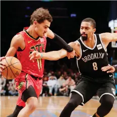  ?? FRANK FRANKLIN II/THE ASSOCIATED PRESS ?? Spencer Dinwiddie, right, has been a catalyst for the Brooklyn Nets in their resurgence (13-4) since beating the Toronto Raptors Dec. 8. The teams will meet again Friday.