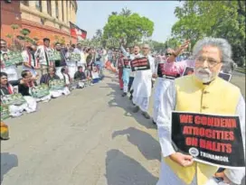  ?? PTI ?? Trinamool Congress leaders protest against the atrocities on Dalits as AIADMK members demonstrat­e for the constituti­on of the Cauvery Management Board, at Parliament House in New Delhi on Tuesday.