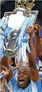  ?? ?? Fernandinh­o lifts the Premier League crown