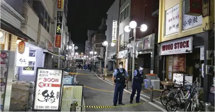  ?? The Yomiuri Shimbun ?? Police officers stand at the scene of a stabbing in Kawasaki on Sept 12.