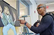  ?? BY JAHI CHIKWENDIU] [PHOTO PROVIDED ?? Comedian Dave Chappelle marvels at a painting by Jada Michelle Logan Smith at Washington, D.C.’s Duke Ellington School of the Arts, where he once attended.