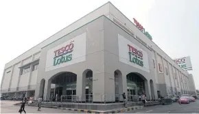  ?? LAUPAISARN­TAKSIN PAWAT ?? Tesco Plc’s sale of its Thai business to entities linked to Charoen Pokphand Group still needs to pass muster with the antitrust authority as to whether the deal is considered a monopoly.