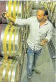  ?? CRAIG YOUDALE/SPECIAL TO POSTMEDIA ?? Winemaker Paul Pender inspects some of the barrels at Tawse Winery.