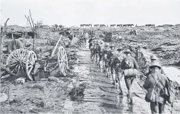  ?? Pictures reproduced courtesy of the Australian War Memorial ?? Soldiers moving up to the front line at the Western Front, Belgium, on November 5, 1917.