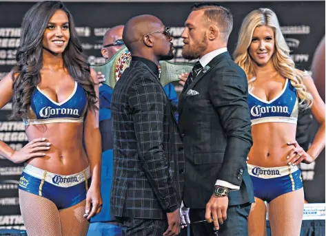  ??  ?? Show time: Conor Mcgregor (right) comes face to face with Floyd Mayweather in Las Vegas as the build-up to their fight gathers pace