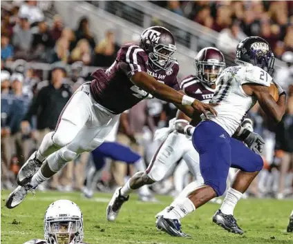  ?? Juan DeLeon / Associated Press ?? The Aggies' defense looks to restore "Wrecking Crew" status behind the likes of Armani Watts, left, and Jarrett Johnson, above.