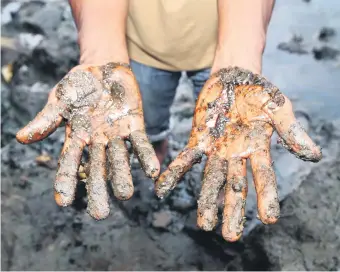  ?? Picture: Bloomberg ?? MUCK AND BRASS. A fisherman in the Niger delta shows the consequenc­es of decades of unregulate­d oil drilling. Frontier investing comes with a lot of muck, but that often hides a wealth of investment opportunit­ies.