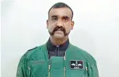  ??  ?? Wing Commander Abhinandan Varthaman in the video released by Pakistan.