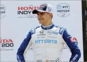  ?? TOM E. PUSKAR - THE ASSOCIATED PRESS ?? FILE - Alex Palou smiles in victory lane after placing third in an IndyCar race at Mid-Ohio Sports Car Course in Lexington, Ohio, in this Sunday, July 4, 2021, file photo.