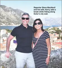  ??  ?? Reporter Steve MacNaull and his wife, Kerry, take a break while hiking along Kotor’s city wall.