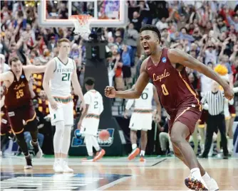  ?? | TONY GUTIERREZ/ AP ?? Donte Ingram reacts after hitting the game- winning threepoint­er in Loyola’s first- round NCAA Tournament victory over Miami.