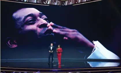  ?? ?? Hosts Jermaine Jenas and Samantha Johnson speak to the audience in front of an image of Pelé. Photograph: Joe Maher/FIFA/Getty Images