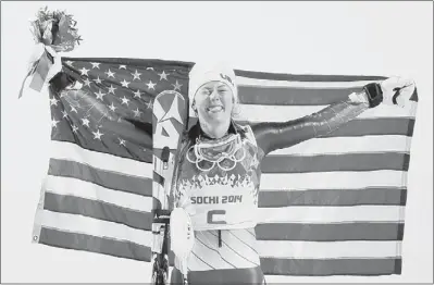  ?? Christophe Ena/Associated Press ?? Women’s slalom gold medal winner Mikaela Shiffrin, 18, is all smiles on the podium at the 2014 Winter Olympics in Krasnaya Polyana, Russia.