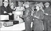  ??  ?? Men wait in a local soup line during the Great Depression in the 1930s.