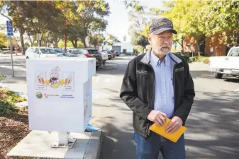  ?? Brittany Hosea- Small / Special to The Chronicle ?? Arne Simonsen of Antioch has voted for Trump the second time around. Arenson, standing next to a ballot dropbox at Antioch City Hall, is in a tight race to keep his post as city clerk.