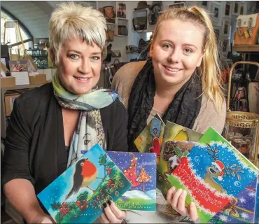  ??  ?? Artist Fiona Turley of Gallery Crafts, Kilworth, with Jesse Wiesblatt of Breakthrou­gh Cancer Research showing the range of 2018 Christmas Cards taht Fiona has once again created and are now on sale for the cancer charity. Photo: Michael Mac Sweeney/ Provision