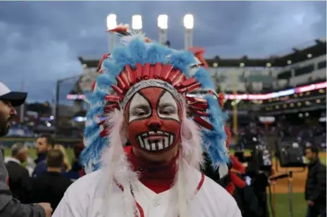  ?? ANDREW SPEAR/THE NEW YORK TIMES FILE PHOTO ?? Austin Howell wears a Chief Wahoo costume before the Indians hosted the Chicago Cubs for Game 1 of the World Series in Cleveland.