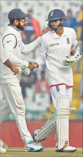  ?? PTI PHOTO ?? Virat Kohli congratula­tes England batsman Haseeb Hameed’s tenacious knock in Mohali Test.