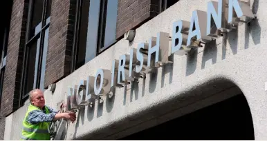  ??  ?? DOWNFALL: The sign is removed from Anglo’s offices at St Stephen’s Green in 2011